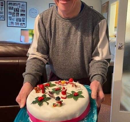 Peter Sherlock with his decorated festive cake