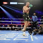 Tyson Fury knocks  down Deontay Wilder