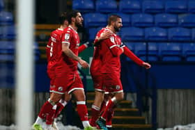 George Francomb celebrates his goal with teammates,
