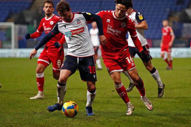 Tom Nichols battles for the ball against Bolton on Saturday