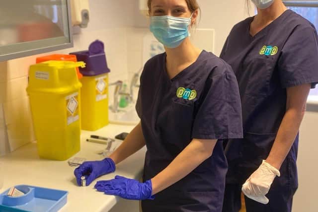 A GP and nurse preparing the vaccine at Pulborough Medical Group