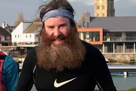 Henry Ainsley, known as The Bearded Runner, on Adur Ferry Bridge in Shoreham at the start of his last half marathon for his 2020 challenge