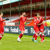 Reds flock to goalscorer Nick Tsaroulla. Picture: UK Sports Images Ltd