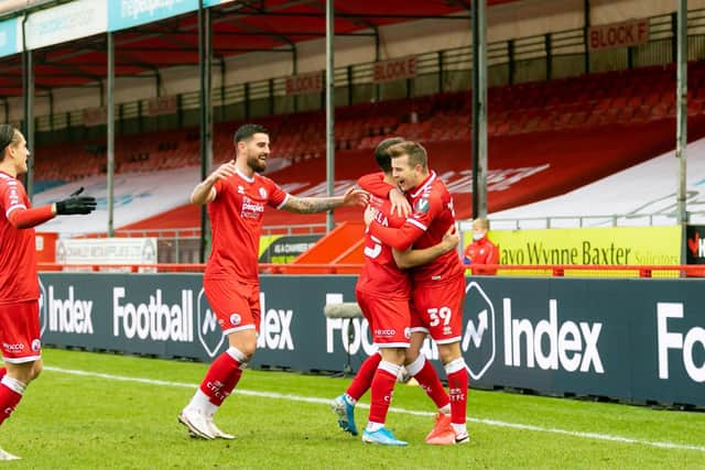 Reds flock to goalscorer Nick Tsaroulla. Picture: UK Sports Images Ltd