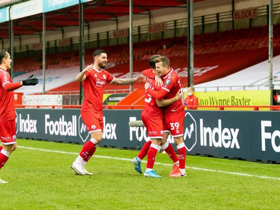 Reds flock to goalscorer Nick Tsaroulla. Picture: UK Sports Images Ltd