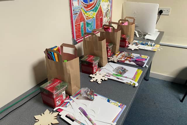 A selection of arts and crafts, and exercise books, are included in the activity packs