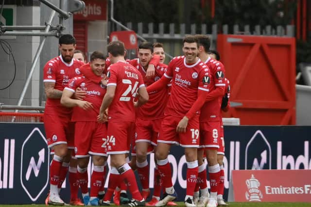 Nick Tsaroulla is mobbed by teammates after his brilliant solo goal