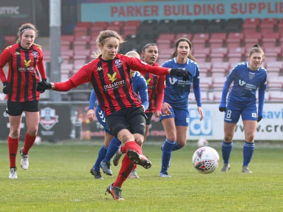 Katie Rood tucks away the penalty / Picture: James Boyes