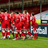 Reds players celebrate after Nick Tsaroulla's goal. Picture by UK Sports Images Ltd