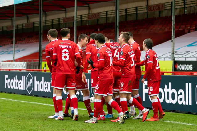 Reds players celebrate after Nick Tsaroulla's goal. Picture by UK Sports Images Ltd