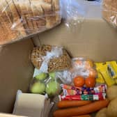 The box of food the mother received SUS-211201-123017001