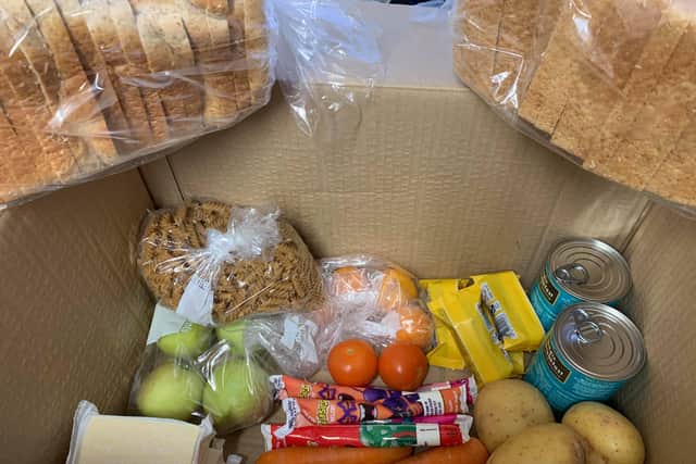 The box of food the mother received SUS-211201-123017001