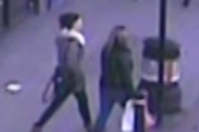 CCTV showing someone who may be Georgina Gharsallah with an unidentified person SUS-210114-102149001