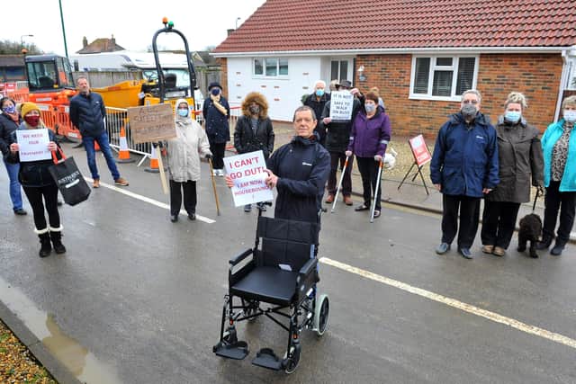 Nigel Rawlins holds the wheelchair of a boy who couldn't attend the protest against the removal of a footpath on Summer Lane, Pagham. Pic Steve Robards SR2101201 PNL-210120-124052001