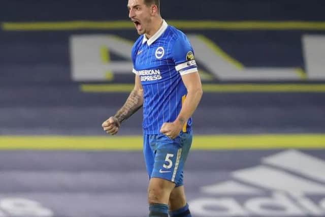Brighton skipper Lewis Dunk celebrates a hard earned three points