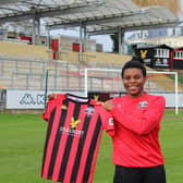 Ini Umotong shows off her new jersey / Picture: Lewes FC