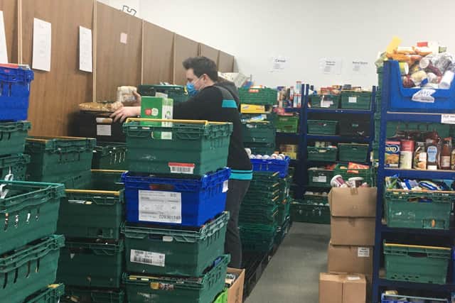 A member of the Horsham Matters team preparing a food parcel