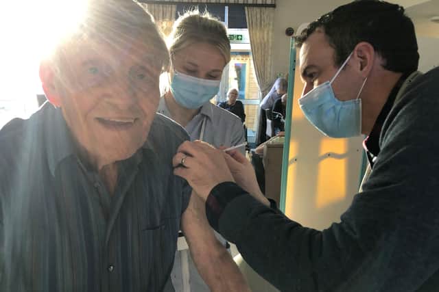 Tony Worthington, resident (left), Molly Worthington, Senior Carer - Head of Dementia Care, Westall House (middle) and Ben McCauly, Vaccinator, HEMS Paramedic Air Ambulance Kent, Surrey & Sussex (right)