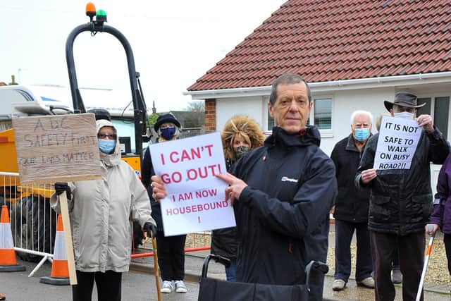 Nigel Rawlins holds the wheelchair of a boy who couldn't attend the protest against the removal of a footpath on Summer Lane, Pagham. Pic Steve Robards SR2101201 PNL-210120-124114001