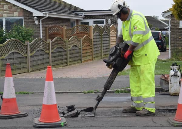 the ‘breaking out’ stage of a pothole repair. The deteriorated area is then removed before the final stages of the repair work are carried out.
