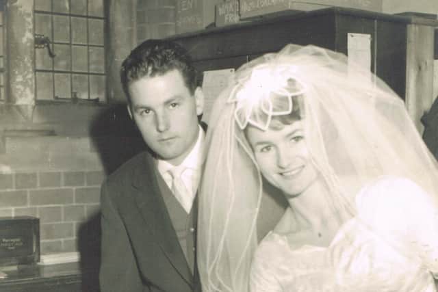 John and Ann Quilter signing the register on their wedding day in 1961