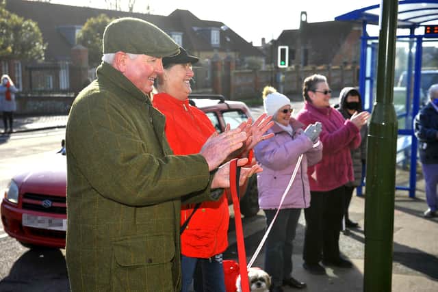 Customers applaud long-standing postmaster Ashok Sthankiya and his wife Shobha at Southlands Post Office. Picture: Steve Robards SR2101231
