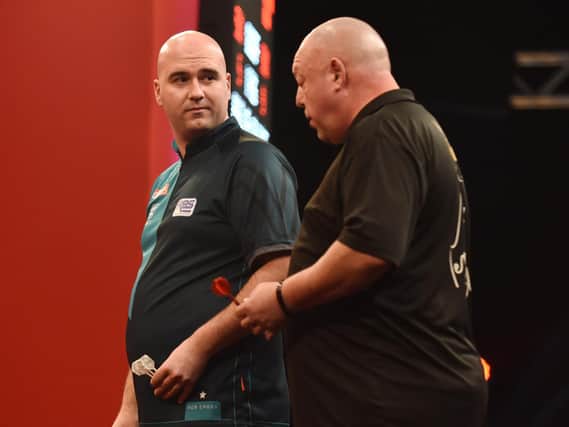 Rob Cross and Mervyn King had a difference of opinion during the match at the Ladbrokes Masters / Picture: Chris Dean - PDC