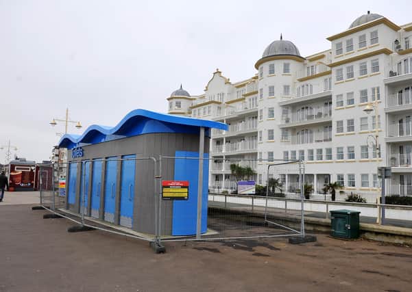 The toilets, with the flats overlooking the block