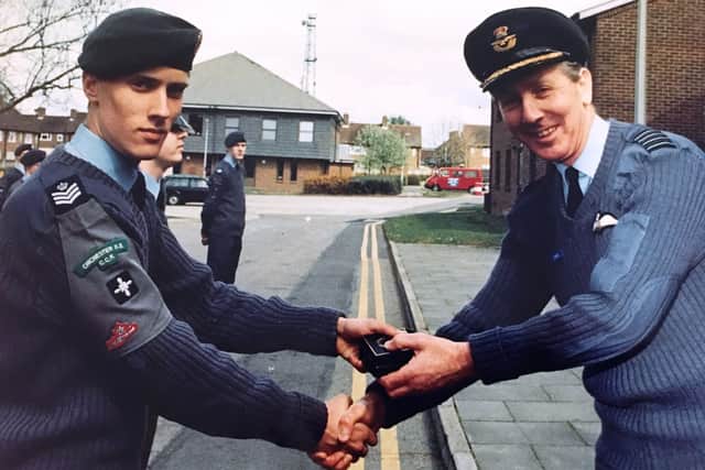 Jean-Claude Guertin, aged 18, senior RAF cadet at Chichester High School for Boys, receiving his Ground Training Competition Medal from the Commanding Officer of RAF Odiham