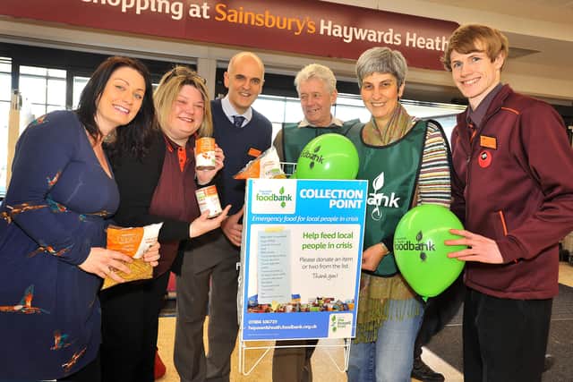 Sainsburys Haywards Heath is allowing the food bank a permanent collection box. L-R Victoria Ponsford (donating food), Jenny Jones and Rafe Overy (Sainsbury), Peter Sargent and Sally Martin (Haywards Heath Foodbank) and Joel Watts (Sainsbury). Pic Steve Robards SUS-150303-132910001