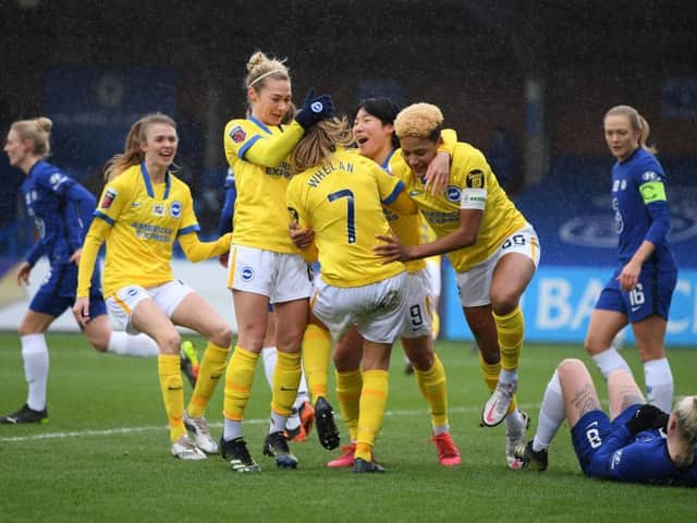 Brighton celebrate their surprise WSL victory at Chelsea yesterday