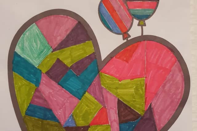 Bright and colourful balloons and a heart