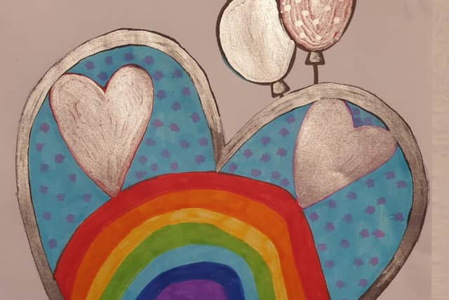 Another card design featuring a rainbow and silver love hearts