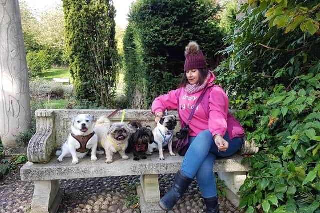 Ms Kelt with her four dogs. SUS-211002-171558001