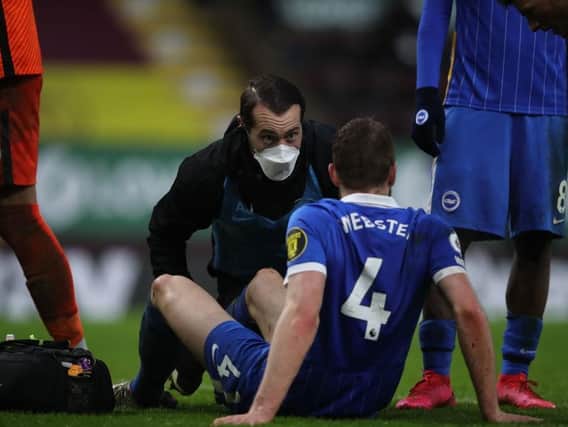 Key defender Adam Webster faces a battle to be fit to face Villa after injuring his ankle at Burnley last week