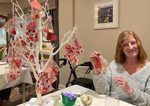 Westlake resident with the decorated love tree