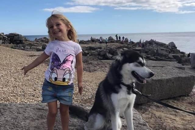 Annalise Goldsmith-Mercer with Diesel, her family's three-year-old Siberian husky