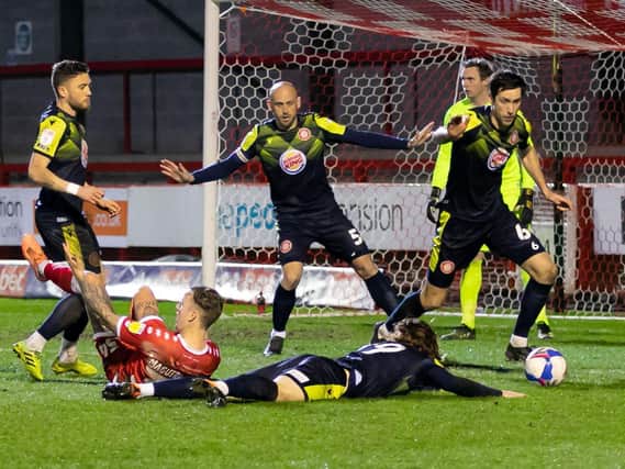 Over they go ... action between Crawley and Stevenage on Tuesday night / Picture: Jamie Evans/UK Sport Images