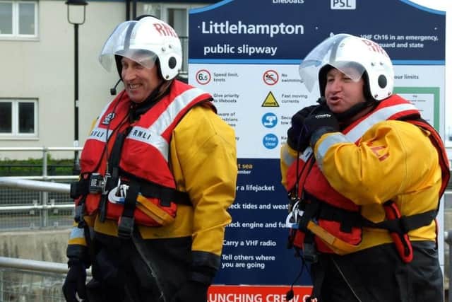 Andy Harris, left, and fellow helm Ivan Greer in full lifesaving kit, preparing for a training session, pre-Covid. Picture: RNLI