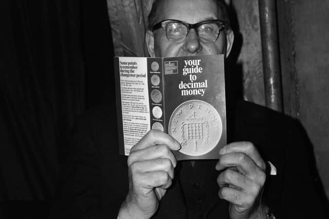 December 29, 1971 Lord Fishe holding a pamphlet introducing the decimal currency. Photo by Evening Standard/Getty Images