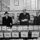 Lord Fiske, Chairman of the Decimal Currency Board, 'decimal shopping' at Woolworths in the Strand on the first day of national decimalisation. Photo by Dennis Oulds/Central Press/Getty Images
