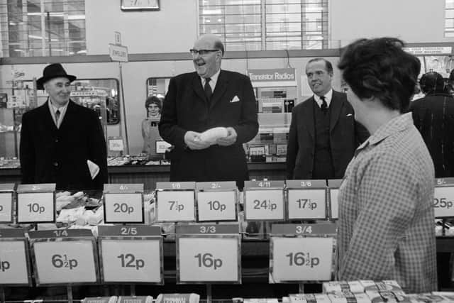 Lord Fiske, Chairman of the Decimal Currency Board, 'decimal shopping' at Woolworths in the Strand on the first day of national decimalisation. Photo by Dennis Oulds/Central Press/Getty Images