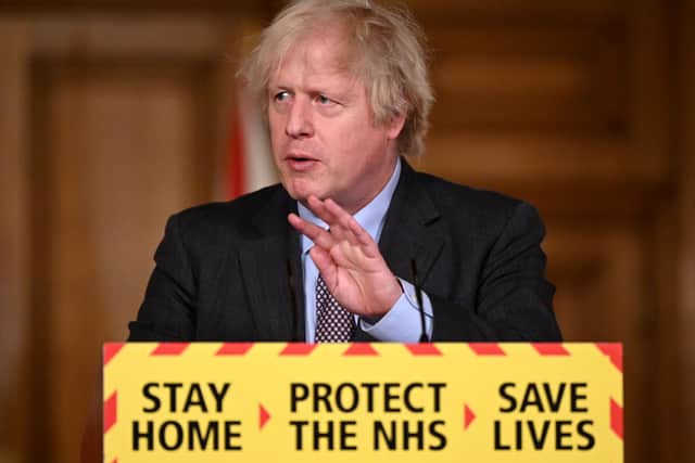 Boris Johnson sets out his plan to ease lockdown restrictions on Monday evening (Photo by LEON NEAL/POOL/AFP via Getty Images)