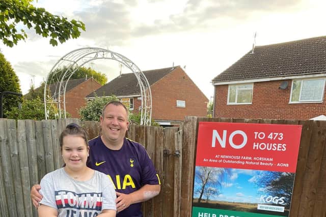 Colin Chard and his daughter Emily Jane outside their home near the proposed development site