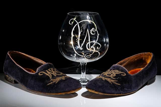 A pair of slippers and brandy glass belonging to Winston Churchill are being sold by a Wisborough Green auction house