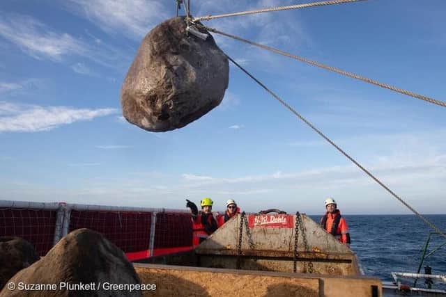 Inert granite boulders are being placed into the English Channel as part of a new bottom trawler exclusion zone in the Offshore Brighton Marine Protected Area. The initiative will help prevent destructive bottom trawling which destroys the Offshore Brighton Marine Protected Area's protected seabed. Photo: Suzanne Plunkett/Greenpeace