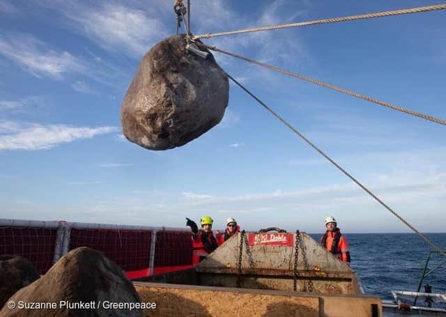 Inert granite boulders are being placed into the English Channel as part of a new bottom trawler exclusion zone in the Offshore Brighton Marine Protected Area. The initiative will help prevent destructive bottom trawling which destroys the Offshore Brighton Marine Protected Area's protected seabed. Photo: Suzanne Plunkett/Greenpeace