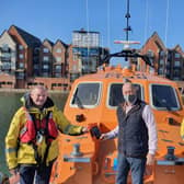 Michael Harris from the Sussex Masonic Charitable Foundation, lifeboat coxswain Mark Sawyer and Carl Pocock, Eastbourne's lifeboat operations manager SUS-210203-124945001