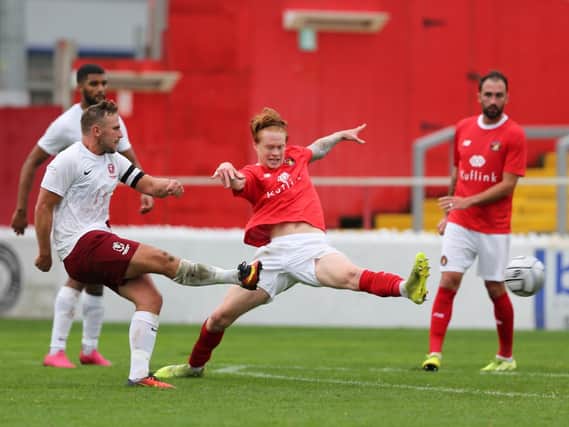 Sam Adams fires in a shot in Hastings' FA Cup tie against Ebbsfleet in October / Picture: Scott White