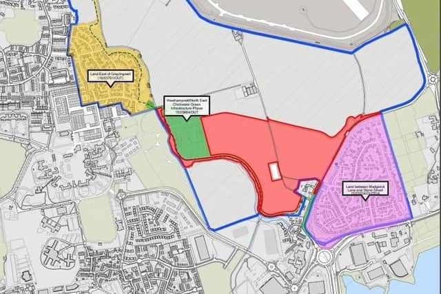 The application site is in red, with other developments in yellow and purple. Green is the green infrastructure land